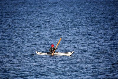 Person sailing kayak in baltic sea