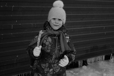 Portrait of girl standing in snow