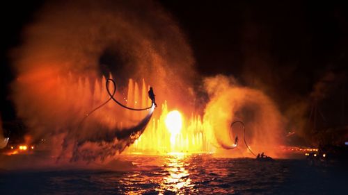 View of fire in sea at night