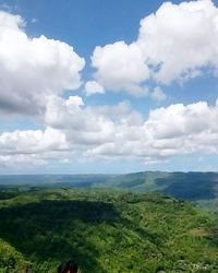 Scenic view of landscape against cloudy sky