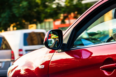 Close-up of reflection on side-view mirror