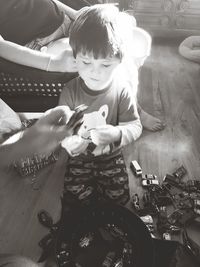 Full length of boy sitting on stage