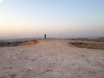 Scenic view of desert against clear sky