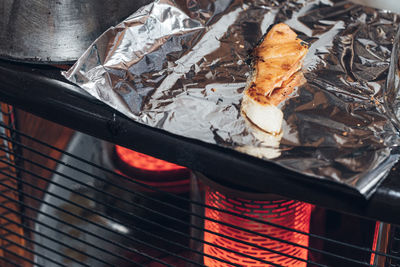 High angle view of meat on barbecue grill