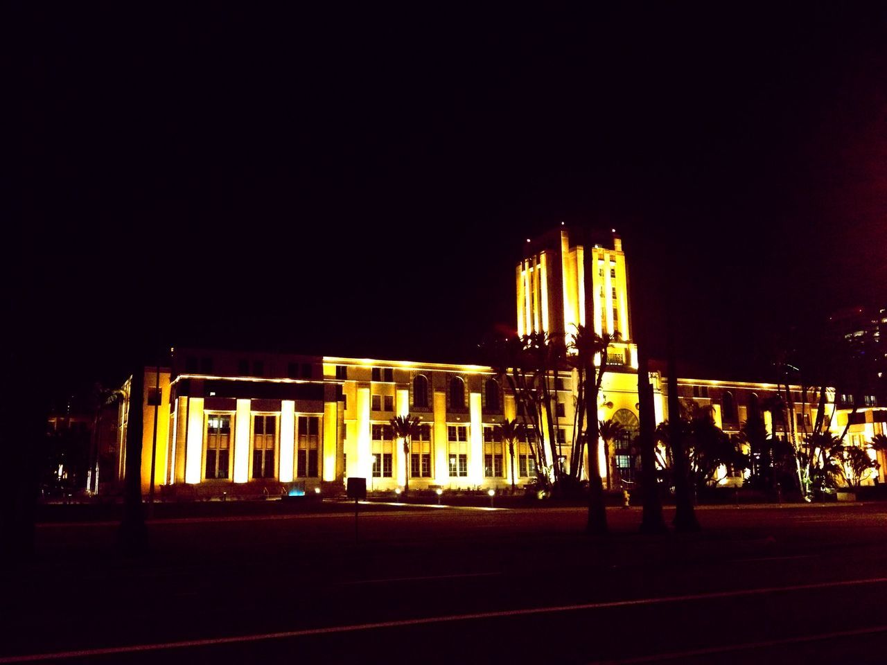 illuminated, night, architecture, built structure, building exterior, clear sky, transportation, city, copy space, mode of transport, incidental people, outdoors, city life, street, street light, lighting equipment, amusement park, sky, travel