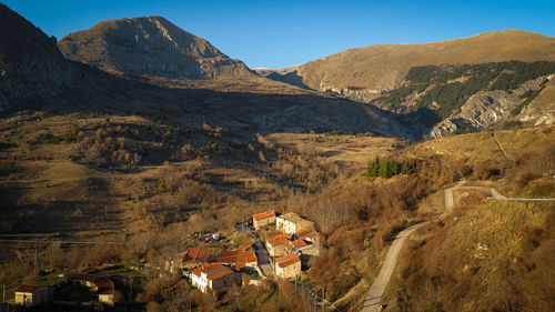 High angle view of houses and mountains against sky