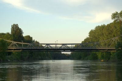 Bridge over river against sky