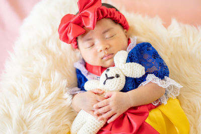 High angle view of cute girl with teddy bear