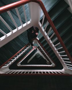 High angle view of man standing on spiral staircase