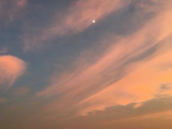 Low angle view of dramatic sky during sunset