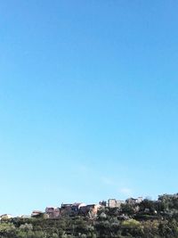 Buildings against blue sky and clouds