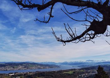 Scenic view of mountains against cloudy sky