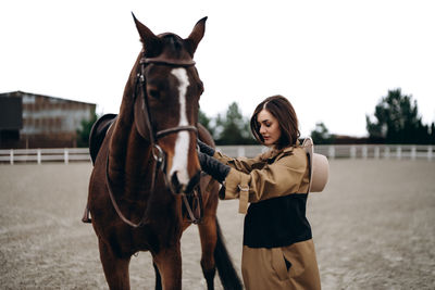 Portrait of woman riding horse