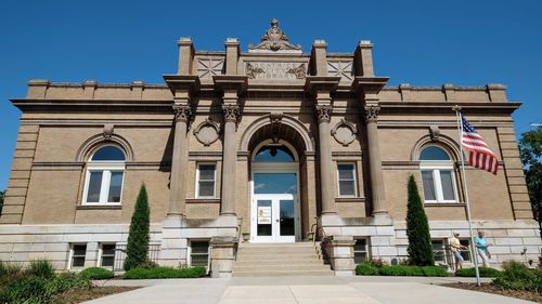 Facade of historic building against sky