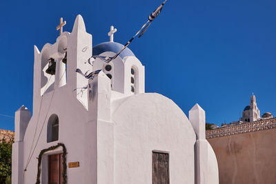 Saint ierotheos holy chapel - blue dome and bell tower - pyrgos village, santorini island, greece