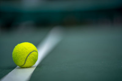 Close-up of tennis ball on field