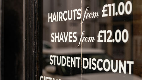 Barbers shop window with information and prices