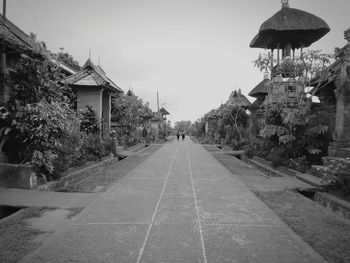 Panoramic view of buildings and trees against sky in city