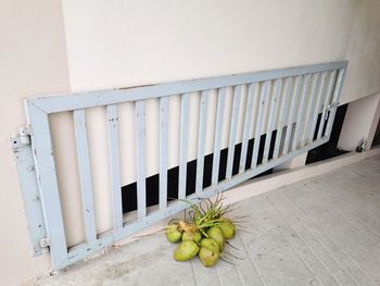 White fruit on floor against wall in building