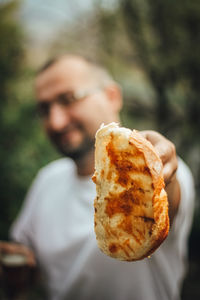 Close-up of man holding ice cream