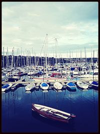 Boats moored at harbor