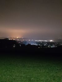 Scenic view of field against sky at night