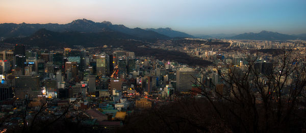 High angle view of illuminated buildings in city against sky