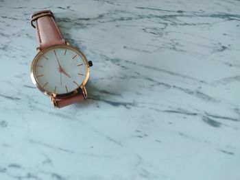 High angle view of clock on sea