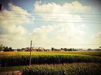 Field against cloudy sky