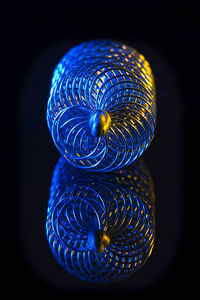 Close-up of light painting against black background