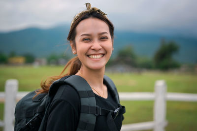 Smile broadly of young women backpacker , freedom and happy concept