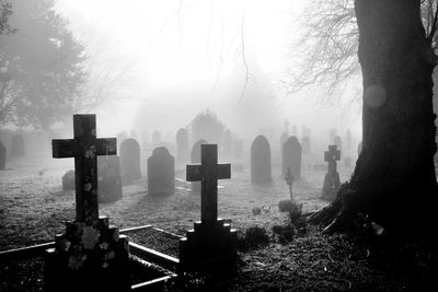 Panoramic view of cemetery against foggy weather