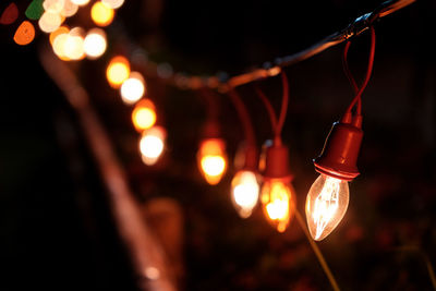 Close-up of illuminated string lights at night