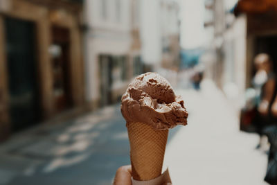 Woman holding ice cream cone