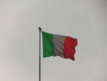 Italian flag waving against sky