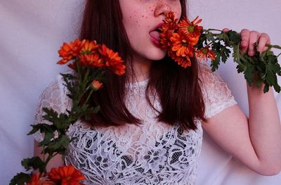 Portrait of woman with red rose