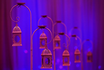 Close-up of clock against blue wall