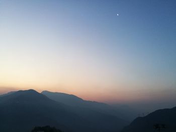 Scenic view of silhouette mountains against clear sky