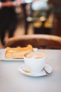 Close-up of coffee cup on table