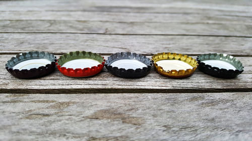 Close-up of bottle caps on table