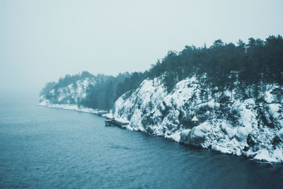 Scenic view of frozen lake against clear sky