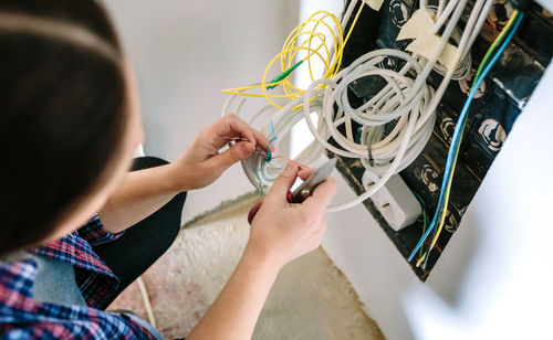 Cropped hands of woman using digital tablet