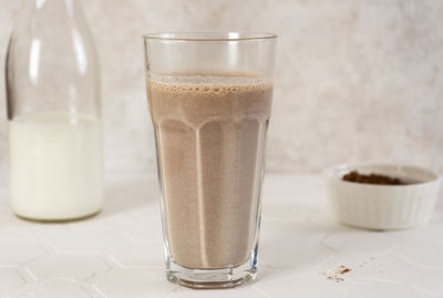 Delicious homemade cocoa drink with milk and cocoa powder. horizontal orientation.