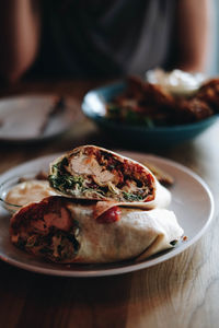 Close-up of chicken burrito served in plate