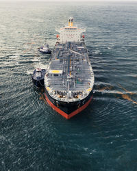 High angle view of ship sailing in sea