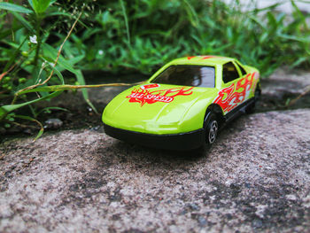 Close-up of toy car on field