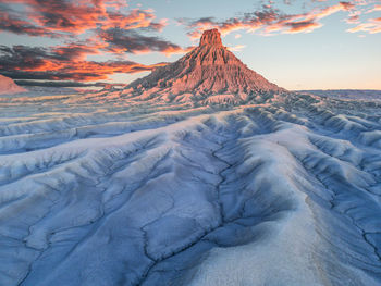 Scenic view of  mountain against sky during sunset