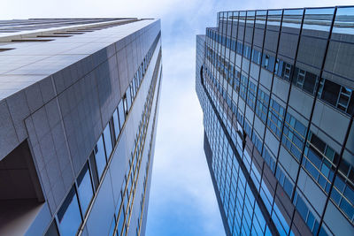 Low angle view of modern buildings against sky