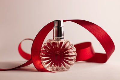 Close-up of umbrella on table against white background