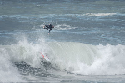 People surfing in sea